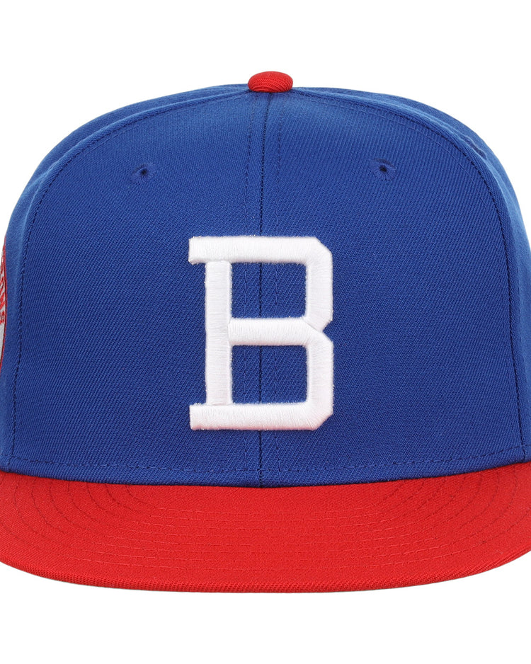 The Buffalo Bisons EFF MiLB Vintage Snapback by Ebbets Field Flannels features a blue crown, red brim, large white B front, and an adjustable snapback. Part of the Vintage Minor League collection.