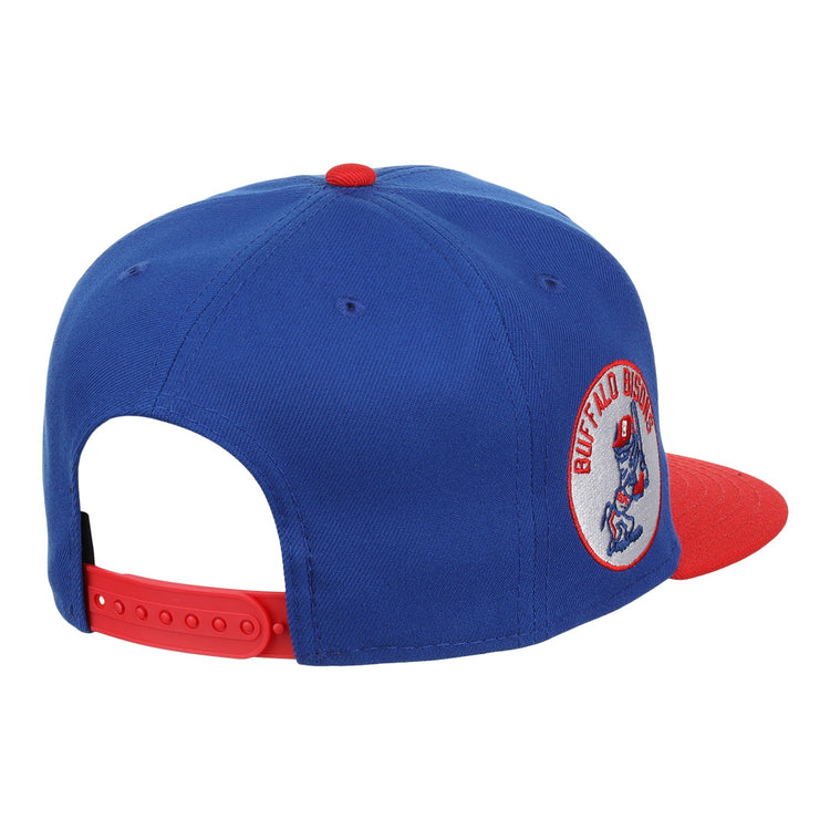 The Buffalo Bisons EFF MiLB Vintage Snapback by Ebbets Field Flannels features a blue crown, red brim and button, bison logo side patch, and a red adjustable strap. Part of the Vintage Minor League collection.