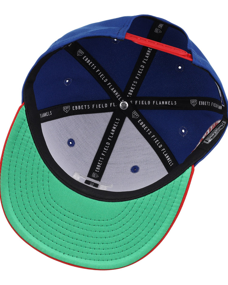 The Buffalo Bisons EFF MiLB Vintage Snapback by Ebbets Field Flannels features a green brim, blue panels, black sweatband, EBBETS FIELD FLANNELS bands, and a snapback closure with red trim on the edge.