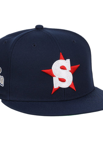 The Ebbets Field Flannels San Bernardino Spirit EFF MiLB Vintage Snapback is a navy cap featuring a large white S with a red star on the front, inspired by the Vintage Minor League team, plus an embroidered California bear patch on the side.