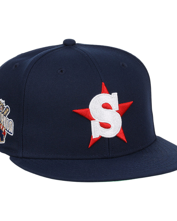 The Ebbets Field Flannels San Bernardino Spirit EFF MiLB Vintage Snapback is a navy cap featuring a large white S with a red star on the front, inspired by the Vintage Minor League team, plus an embroidered California bear patch on the side.