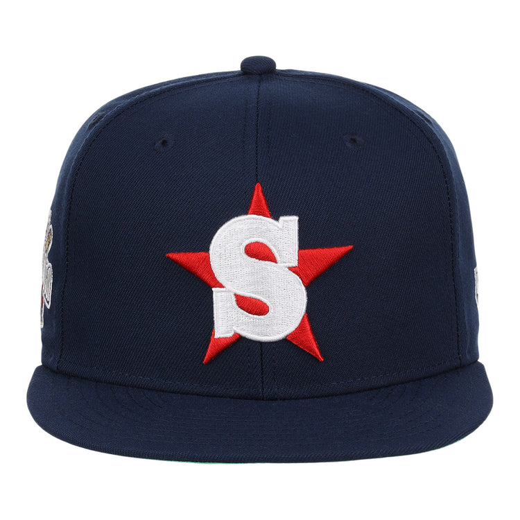 The San Bernardino Spirit EFF MiLB Vintage Snapback by Ebbets Field Flannels is a navy cap with a red star and bold white S on the front, inspired by the classic California League team.