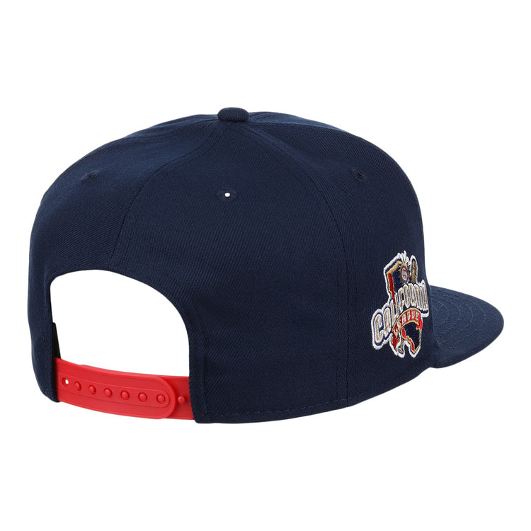 The San Bernardino Spirit EFF MiLB Vintage Snapback by Ebbets Field Flannels is a navy blue cap with a red adjustable strap and an embroidered Champion lion logo, inspired by classic California League and vintage minor league styles.