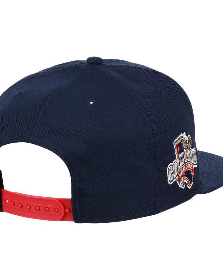 The San Bernardino Spirit EFF MiLB Vintage Snapback by Ebbets Field Flannels is a navy blue cap with a red adjustable strap and an embroidered Champion lion logo, inspired by classic California League and vintage minor league styles.