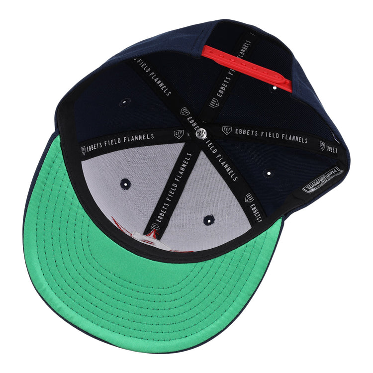 The San Bernardino Spirit EFF MiLB Vintage Snapback by Ebbets Field Flannels features a navy interior, green underbrim, black sweatband, and “EBBETS FIELD FLANNELS” labels—capturing true vintage Minor League style.