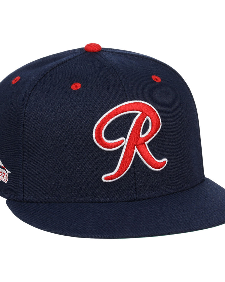 The Seattle Rainiers EFF MiLB Vintage Snapback by Ebbets Field Flannels features navy blue wool, a red and white R front logo, red accents, and a mountains patch—honoring the Pacific Coast Leagues legacy.