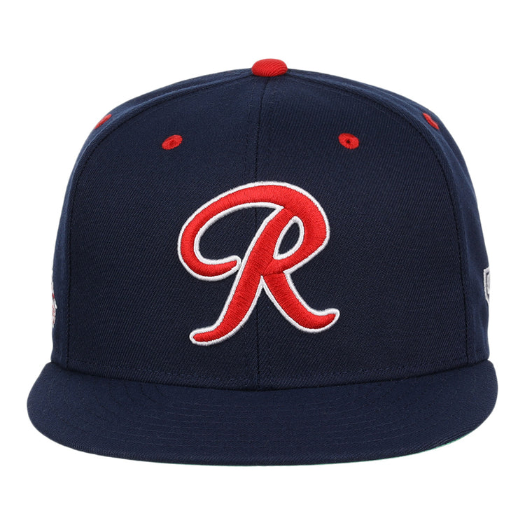 The Seattle Rainiers EFF MiLB Vintage Snapback by Ebbets Field Flannels features a navy blue design, bold red and white R on the front, red accents, flat brim, and is part of the Vintage Minor League collection.