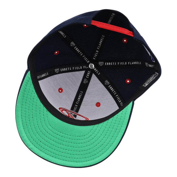 The Seattle Rainiers EFF MiLB Vintage Snapback by Ebbets Field Flannels features a green underbrim, black interior panels with Ebbets Field Flannels branding, red button accents, and a red adjustable strap at the back.