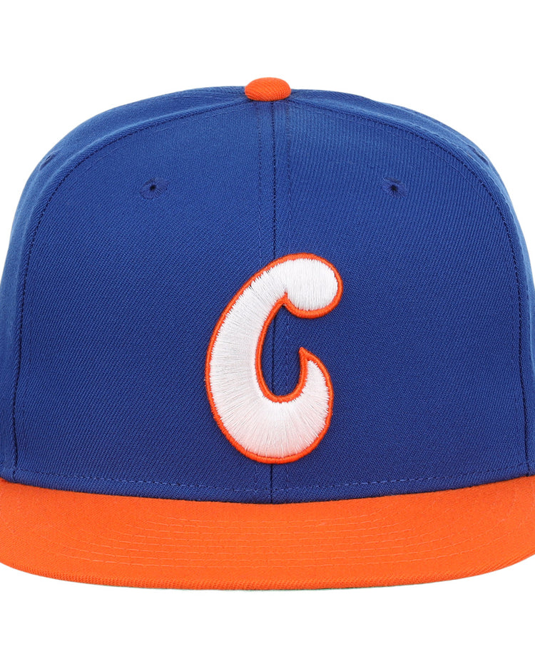 The Ebbets Field Flannels Charlotte Orioles EFF MiLB Vintage Snapback features a blue crown, orange brim, and a large white-and-orange C embroidered on the front.