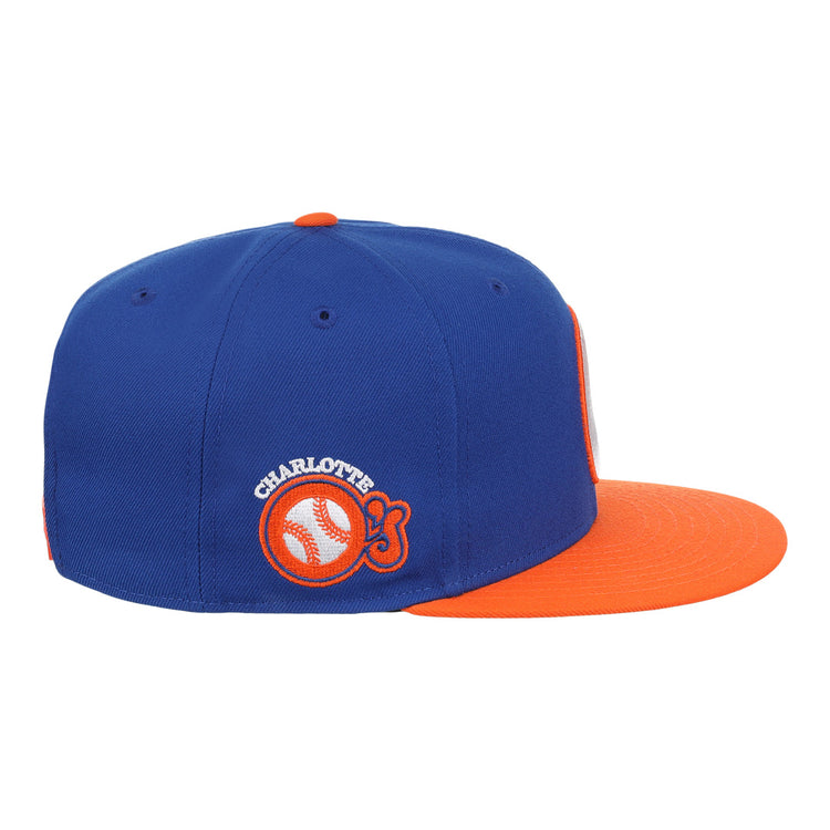 The Charlotte Orioles EFF MiLB Vintage Snapback by Ebbets Field Flannels features a blue crown, orange brim, and classic Orioles logo—ideal for fans of Cal Ripken Jr.s early years with the Charlotte O’s.
