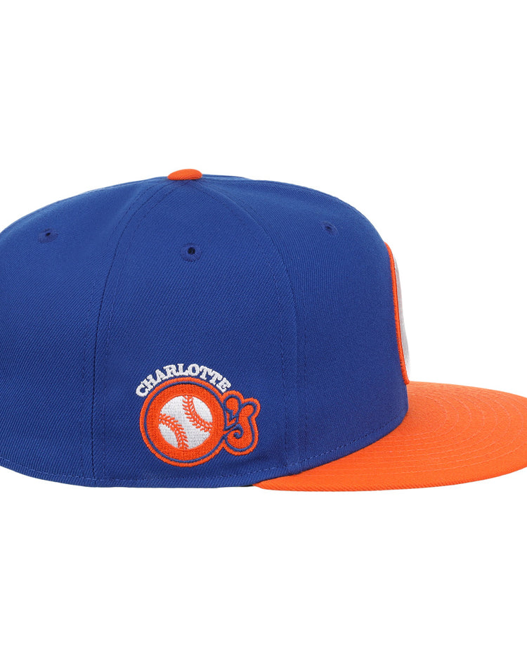 The Charlotte Orioles EFF MiLB Vintage Snapback by Ebbets Field Flannels features a blue crown, orange brim, and classic Orioles logo—ideal for fans of Cal Ripken Jr.s early years with the Charlotte O’s.