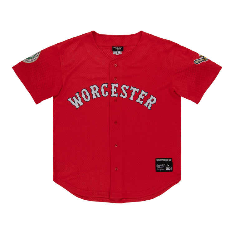 The EFF Worcester Red Sox MiLB Button Down Jersey features a red design inspired by Negro League jerseys, gray Worcester across the chest, black front buttons, and patches on the sleeves and lower left hem.