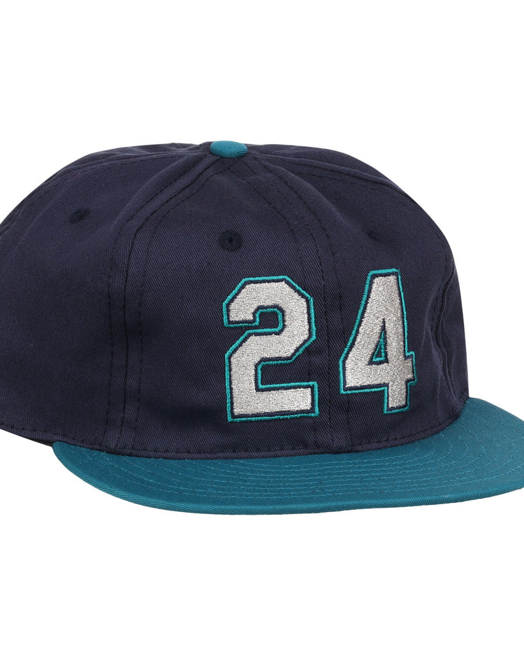 The Ebbets Field Flannels Ken Griffey Jr. 1995 Signature Series Ballcap is navy blue with a teal brim and button, and features the number 24 stitched in white and teal on the front.