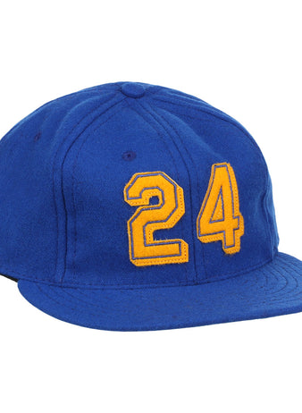 The Ebbets Field Flannels Ken Griffey Jr. 1989 Signature Series Ballcap is a blue vintage wool cap with a curved brim, visible panel stitching, and bold yellow 24 on the front, inspired by classic Griffey Jr. styles.