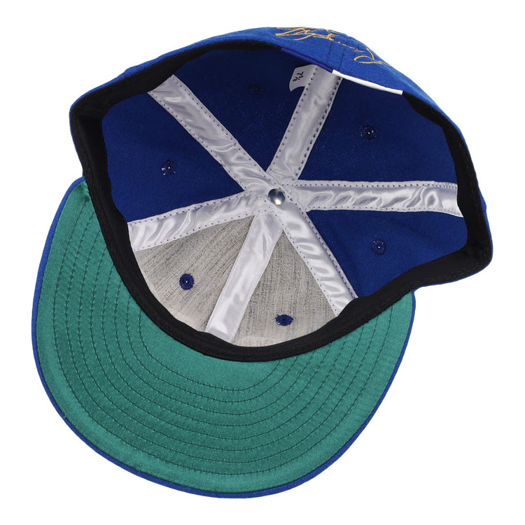Inside view of the Ken Griffey Jr. 1989 Signature Series Ballcap by Ebbets Field Flannels, featuring a green underbrim and white stitched lining strips on the inner crown.