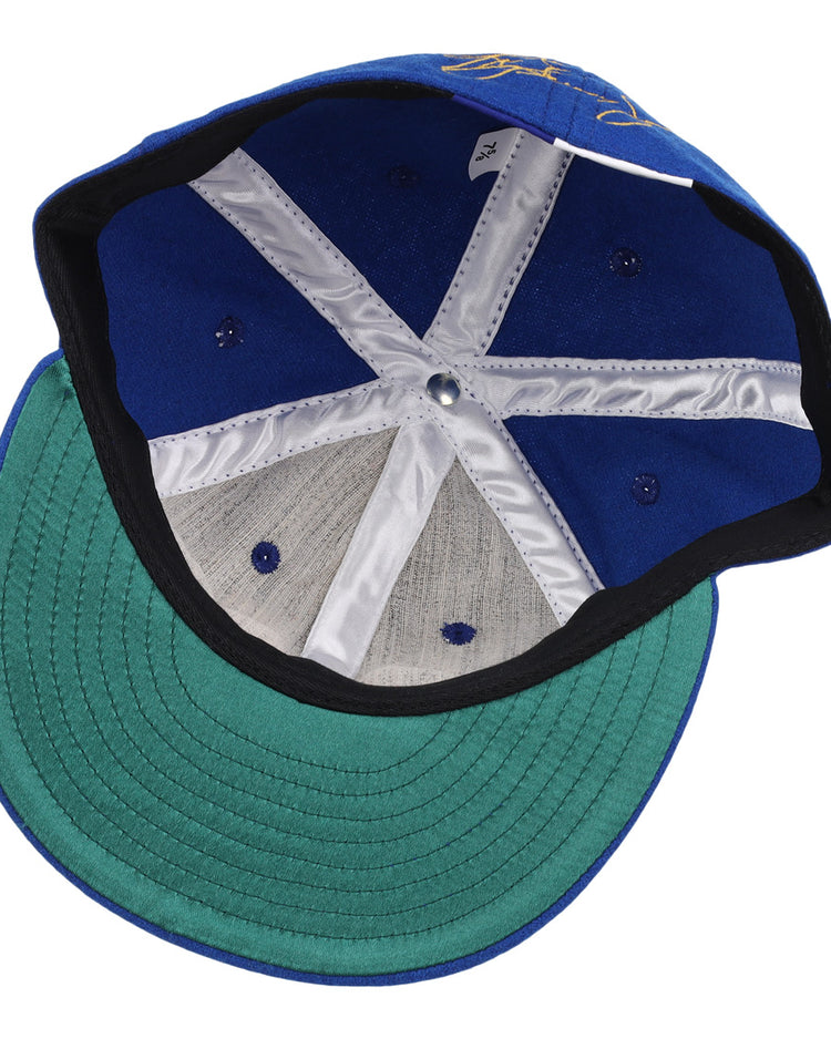 Inside view of the Ken Griffey Jr. 1989 Signature Series Ballcap by Ebbets Field Flannels, featuring a green underbrim and white stitched lining strips on the inner crown.