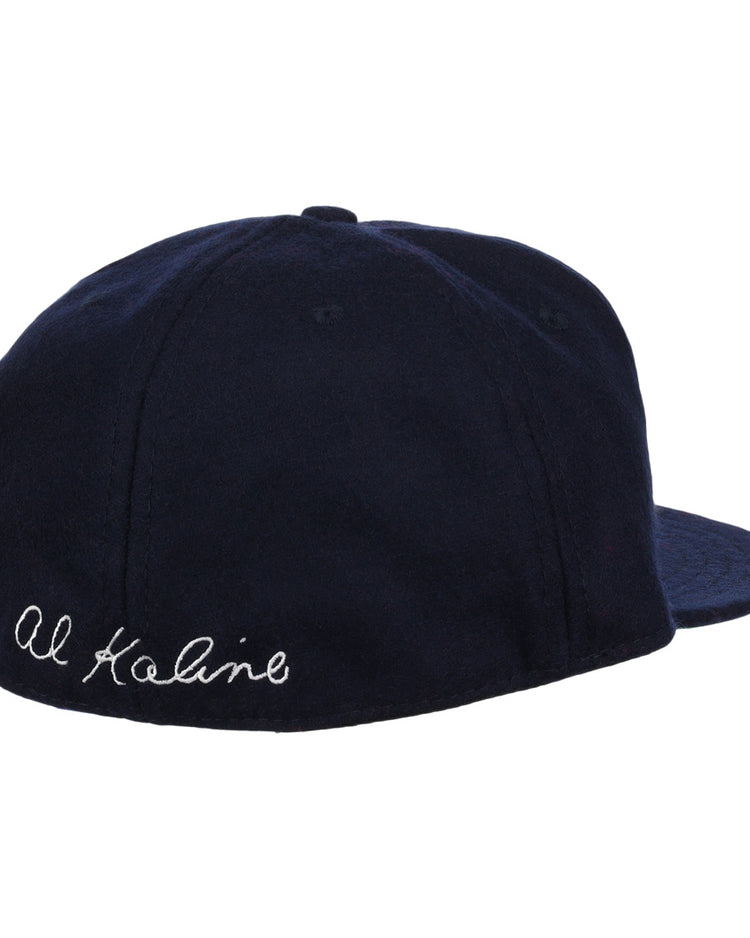 The Al Kaline Signature Series Ballcap by Ebbets Field Flannels is a navy vintage wool cap, shown from the back left, with Al Kaline’s signature embroidered in white cursive near the edge.