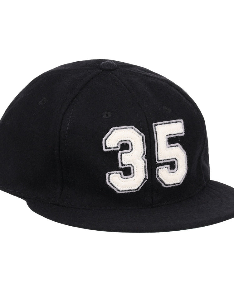The Frank Thomas Signature Series Ballcap by Ebbets Field Flannels is a black vintage wool cap with a bold white 35 on the front—ideal for National Baseball Hall of Fame fans.