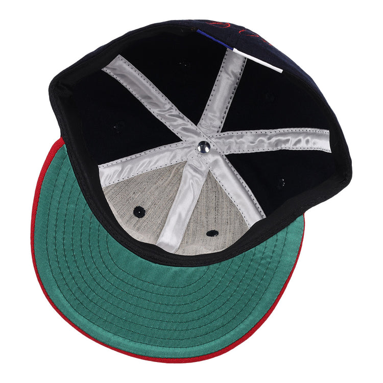 Inside view of the Ebbets Field Flannels Frank Thomas Signature Series Ballcap - Navy, featuring a green underbrim, red edge trim, black interior, white satin taping, and a metallic crown button—a Chicago White Sox classic.