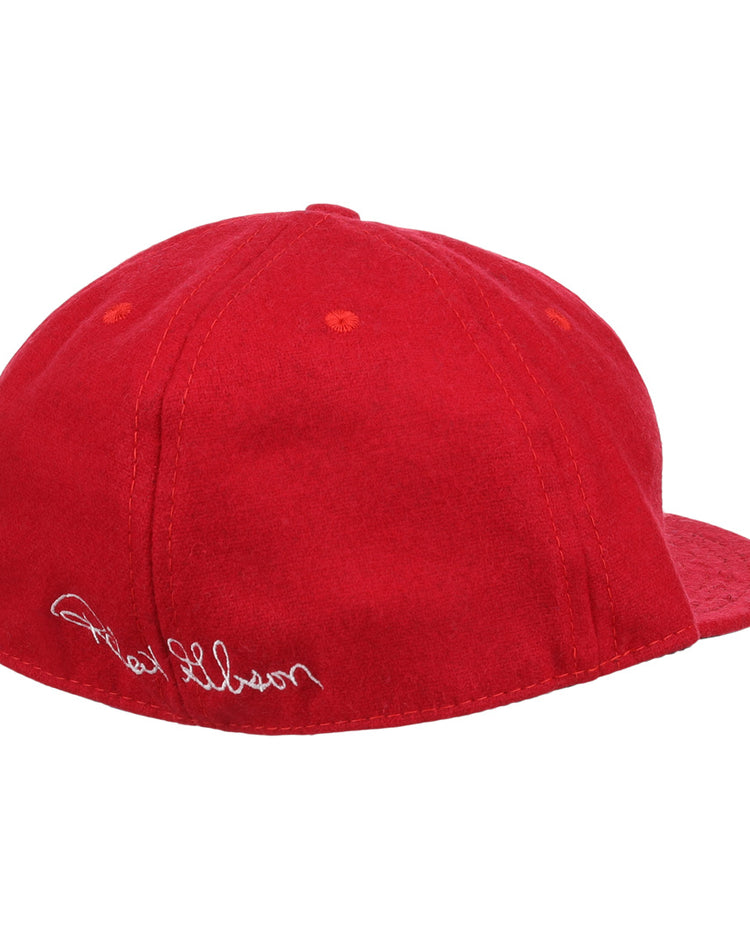 The Bob Gibson Signature Series Ballcap by Ebbets Field Flannels is a bright red vintage wool cap with white cursive embroidery near the adjustable strap, shown from the side and back against a white background.