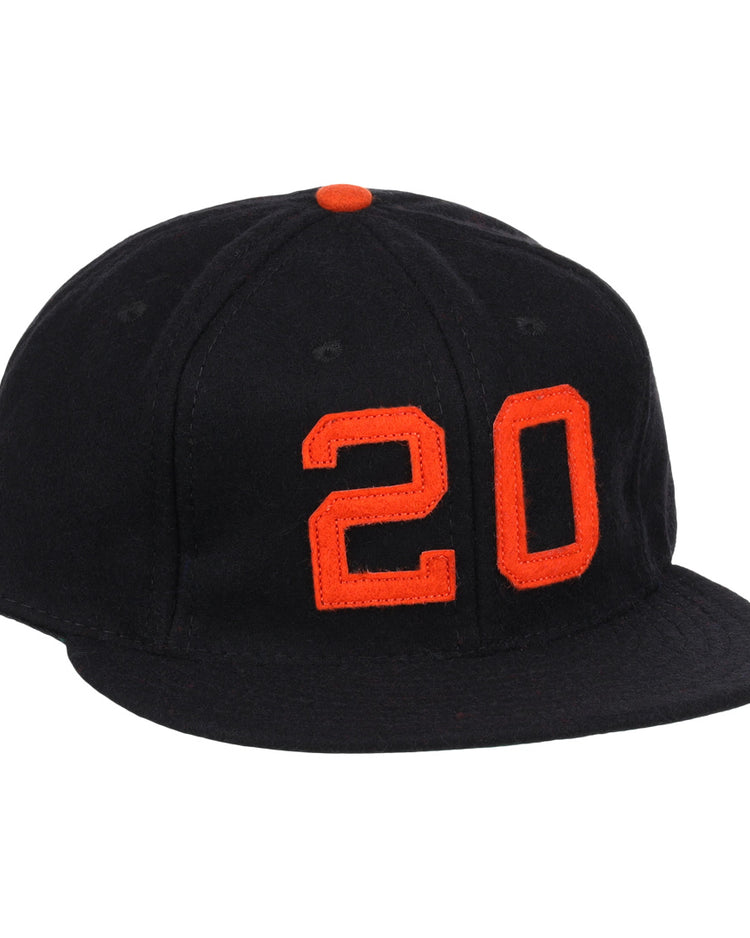 The Monte Irvin Signature Series Ballcap by Ebbets Field Flannels is a black vintage wool cap with an orange top button and bold orange number 20 on the front, honoring Monte Irvin of the Negro National League.