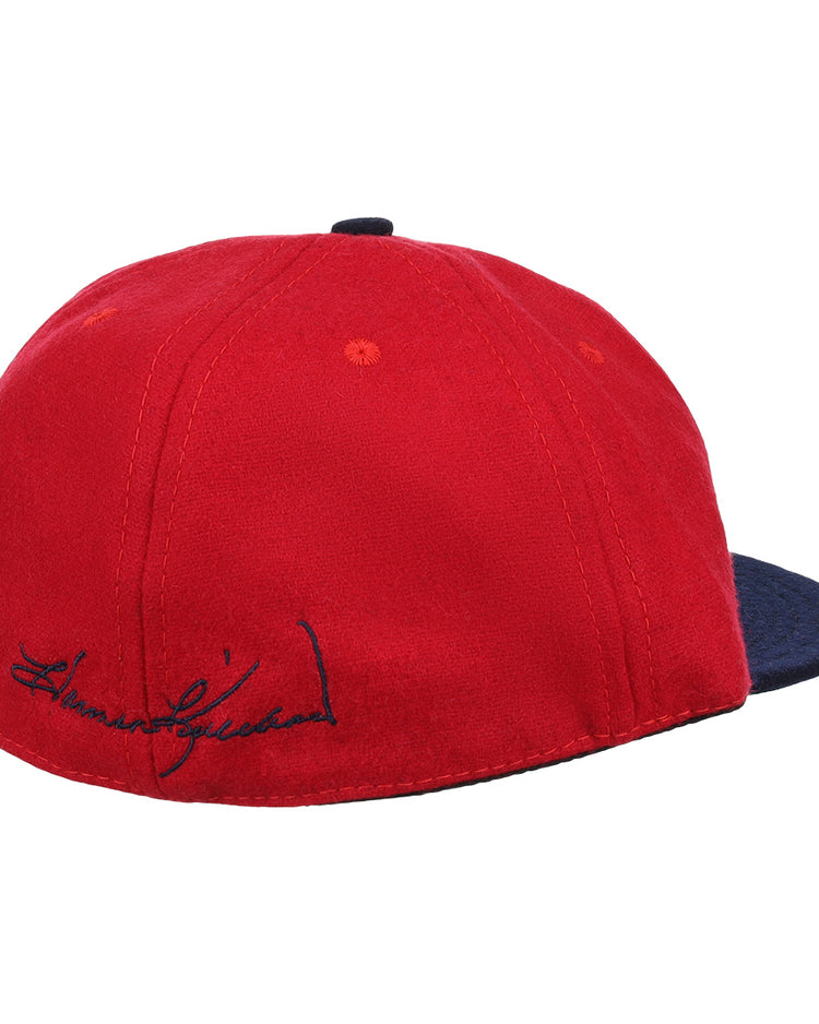 The Ebbets Field Flannels Harmon Killebrew Signature Series Ballcap features red vintage wool, a dark blue brim, and a black embroidered signature above the brim—perfect for National Baseball Hall of Fame fans. Plain white background.