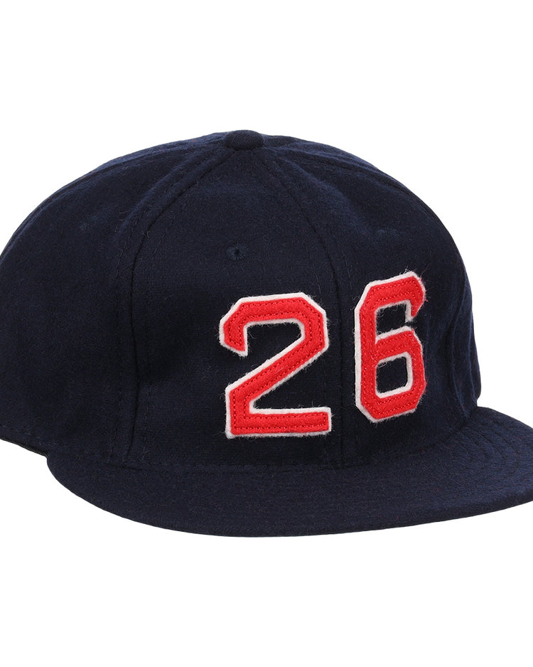 The Ebbets Field Flannels Wade Boggs Signature Series Ballcap is a dark blue vintage wool cap with a red and white number 26 on the front, inspired by classic styles from the National Baseball Hall of Fame.
