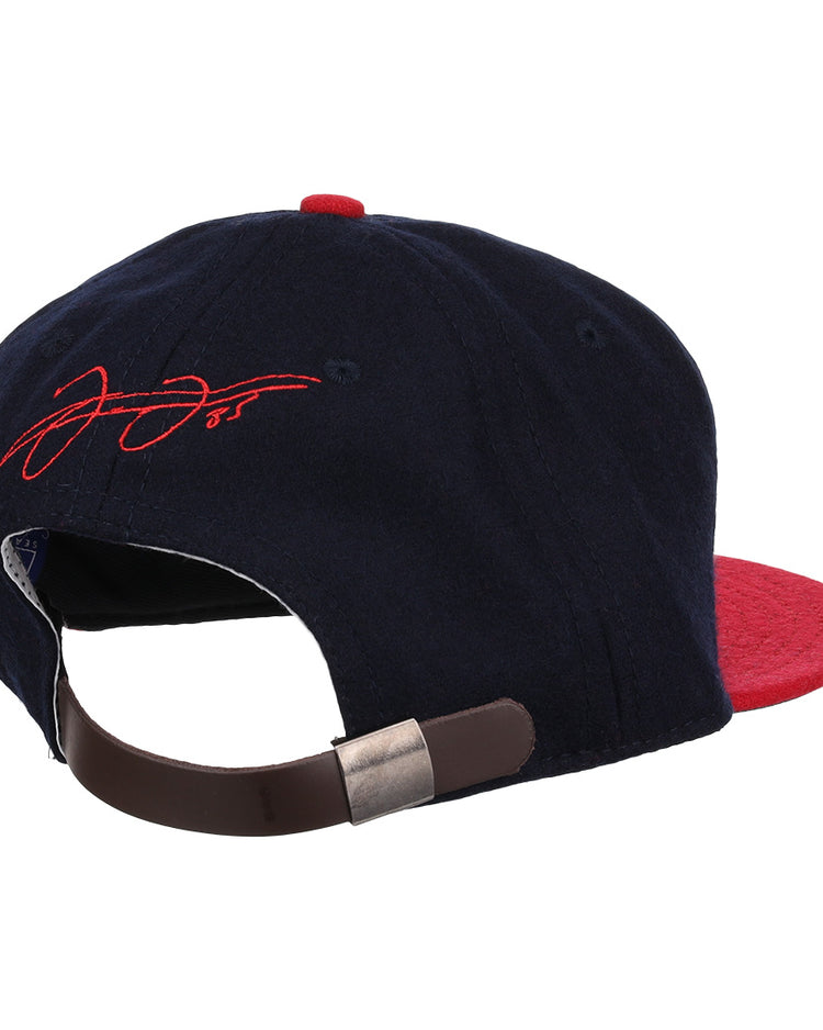 The Frank Thomas Signature Series Ballcap - Navy by Ebbets Field Flannels is a navy and red cap inspired by vintage Chicago White Sox styles, with a brown adjustable strap, metallic clasp, and red signature embroidery on the rear.