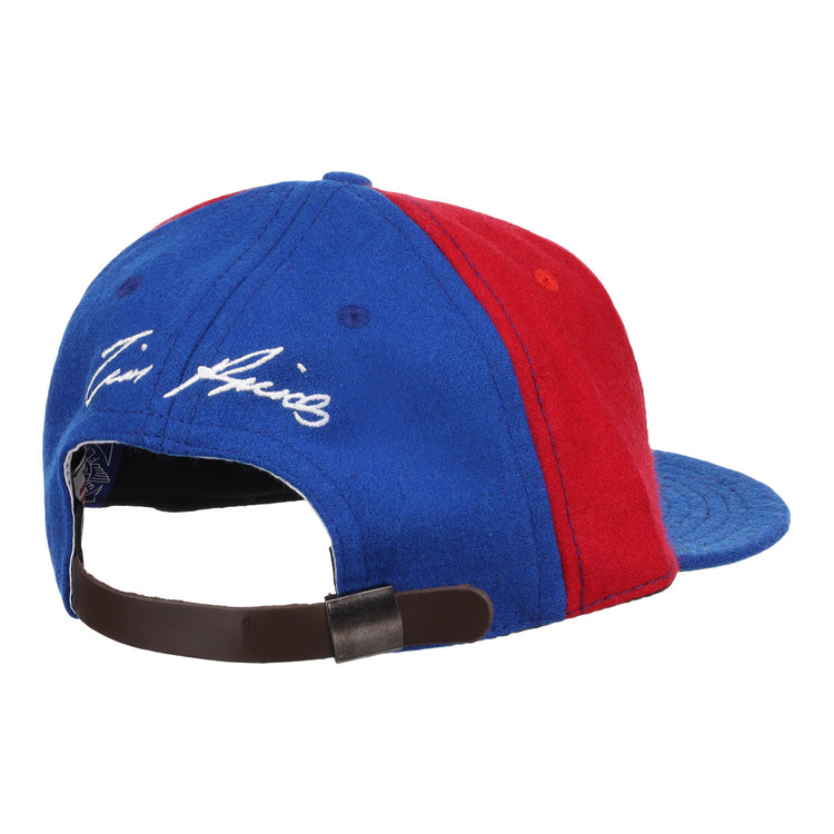 The Ebbets Field Flannels Tim Raines Signature Series Ballcap in blue and red wool features a leather strap with metal clasp and white cursive embroidery above the back opening, capturing classic Tim Raines flair.