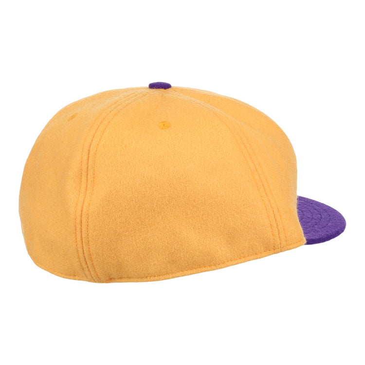 The EFF University of Washington 1936 Rowing Vintage Ballcap in gold features purple brim, visible stitching, and a top button detail, seen from the back and slightly to the side.
