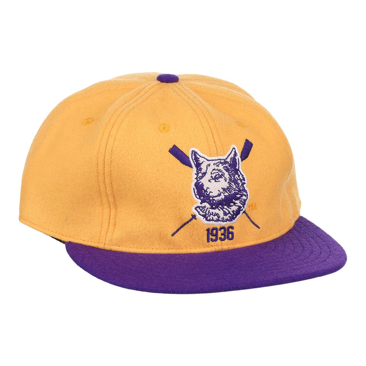The EFF University of Washington 1936 Rowing Vintage Ballcap features gold wool with a purple brim and button, plus a front dog logo, crossed oars, and 1936 for a classic athletic look.