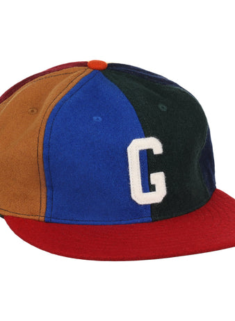 The EFF Homestead Grays Vintage Inspired Pinwheel Ballcap features brown, blue, green, and red panels, a red brim, orange top button, and a bold white G, capturing the classic Negro National League style.