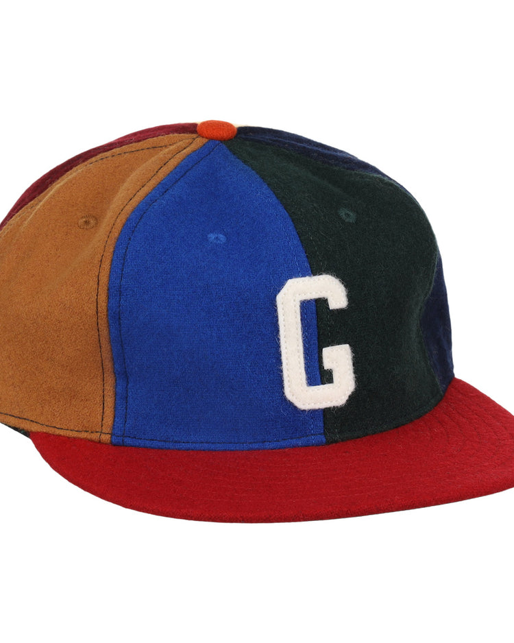 The EFF Homestead Grays Vintage Inspired Pinwheel Ballcap features brown, blue, green, and red panels, a red brim, orange top button, and a bold white G, capturing the classic Negro National League style.