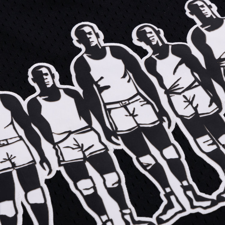 A close-up of the Black Fives Basketball Jersey by EFF, showcasing black fabric with repeated white graphics of men in shorts and tank tops, inspired by the bold, stylized art of Black Fives basketball history.