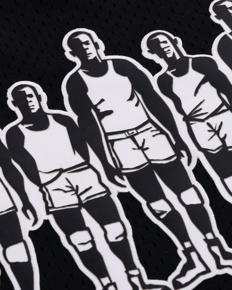 A close-up of the Black Fives Basketball Jersey by EFF, showcasing black fabric with repeated white graphics of men in shorts and tank tops, inspired by the bold, stylized art of Black Fives basketball history.