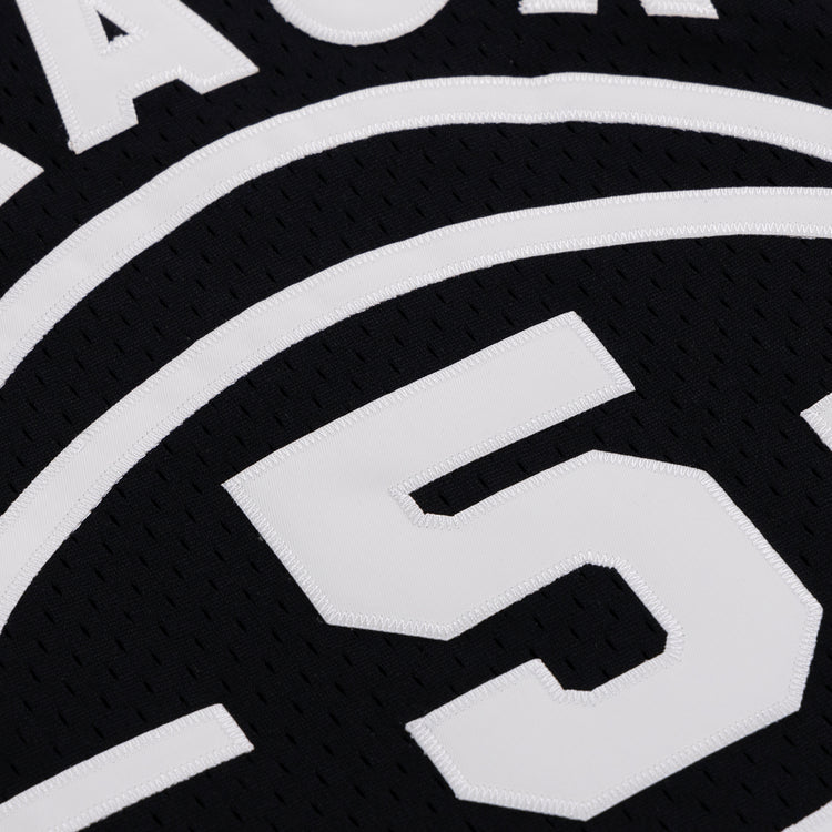 Close-up of the Black Fives Basketball Jersey by EFF, showcasing white stitched numbers—prominently the large number 5—and curved lines, honoring Black basketball heritage.