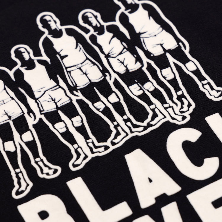 Illustration of six athletes in tank tops and shorts, with bold WHITE BLACK text beneath on a dark background—celebrating Black basketball history. Featured: Black Fives T-Shirt by Ebbets Field Flannels.