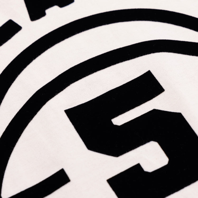 Close-up of the bold black number 5 and lettering on the Ebbets Field Flannels Black Fives T-Shirt in white, evoking Black basketball history and the legacy of the Black Fives.