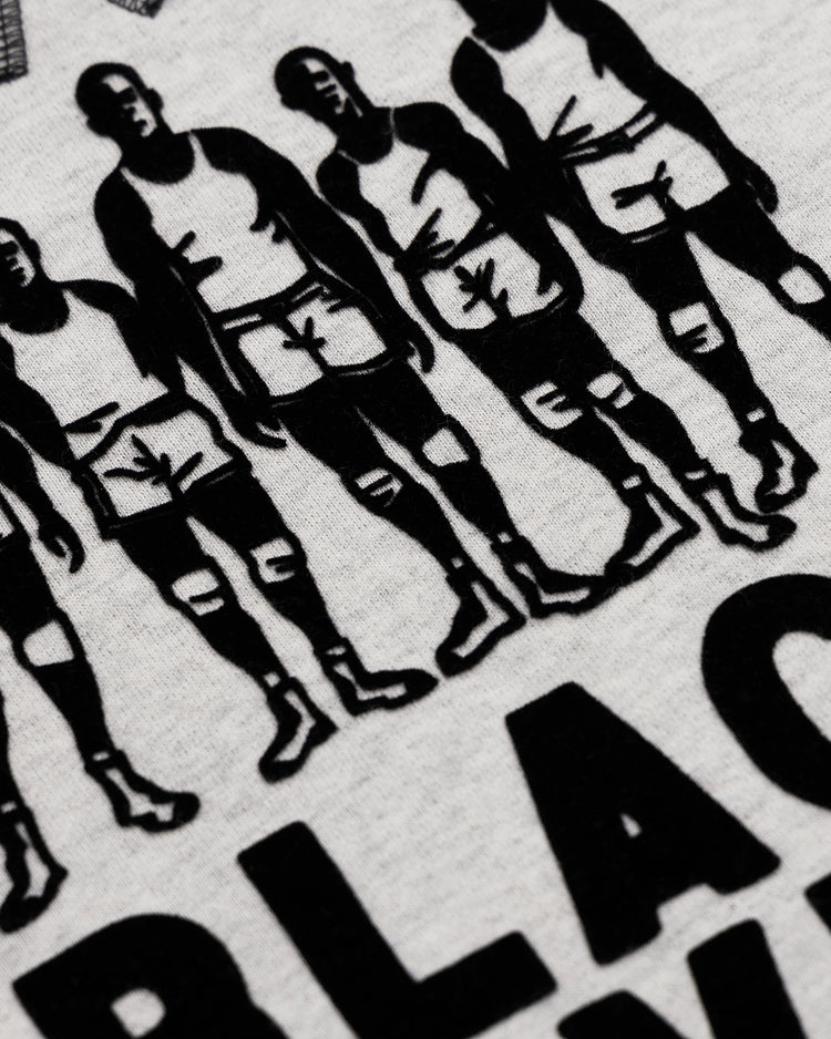 Black-and-white illustration of six basketball players in tank tops and shorts, with partial bold BLACK text underneath, featured on the EFF Black Fives Crewneck—a tribute to Black basketball history on light Ebbets Field Flannels fabric.