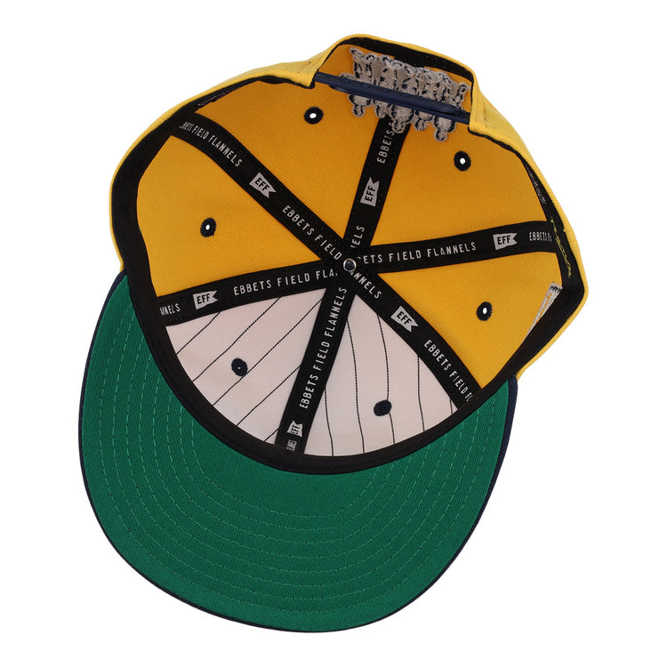 The New York Rens Snapback Ballcap by Ebbets Field Flannels features a yellow crown, green underbrim, black Ebbets Field Flannels interior bands, and white pinstriped lining—honoring Black basketball history and the legendary New York Rens.