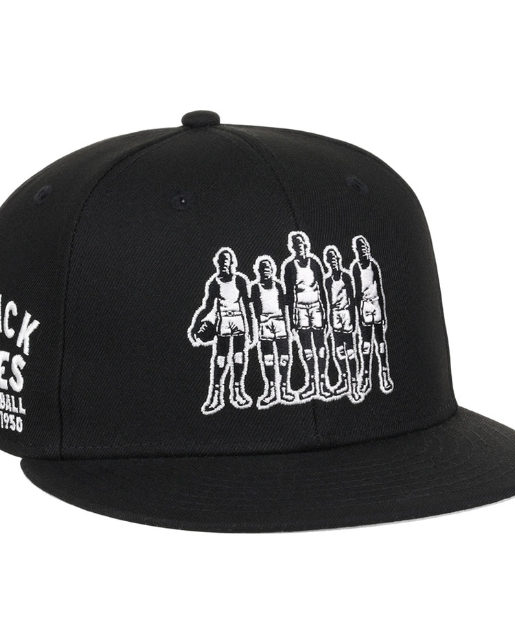 The Black Fives Fitted Ballcap by Ebbets Field Flannels features an embroidered outline of five vintage basketball players and BLACK FIVES BASKETBALL 1904-1950 on the side, honoring Black Fives history and Ebbets Field Flannels heritage.