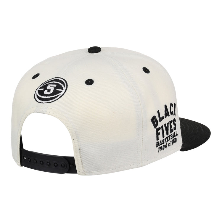 The Ebbets Field Flannels Black Fives Snapback Ballcap is a white and black cap with a side round Black Fives logo and “BLACK FIVES BASKETBALL 1904 x 1950” embroidered on the right, honoring Black basketball history.