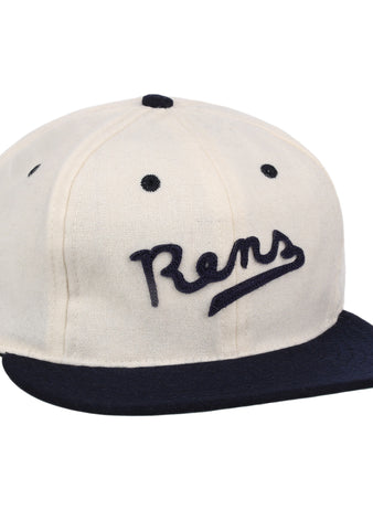 The New York Rens Wool Ballcap by Ebbets Field Flannels is a vintage-style white cap with a navy brim and Rens embroidered in script, celebrating Black basketball history and the legacy of the legendary team.