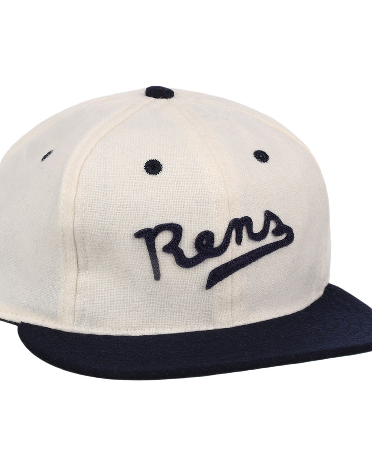 The New York Rens Wool Ballcap by Ebbets Field Flannels is a vintage-style white cap with a navy brim and Rens embroidered in script, celebrating Black basketball history and the legacy of the legendary team.