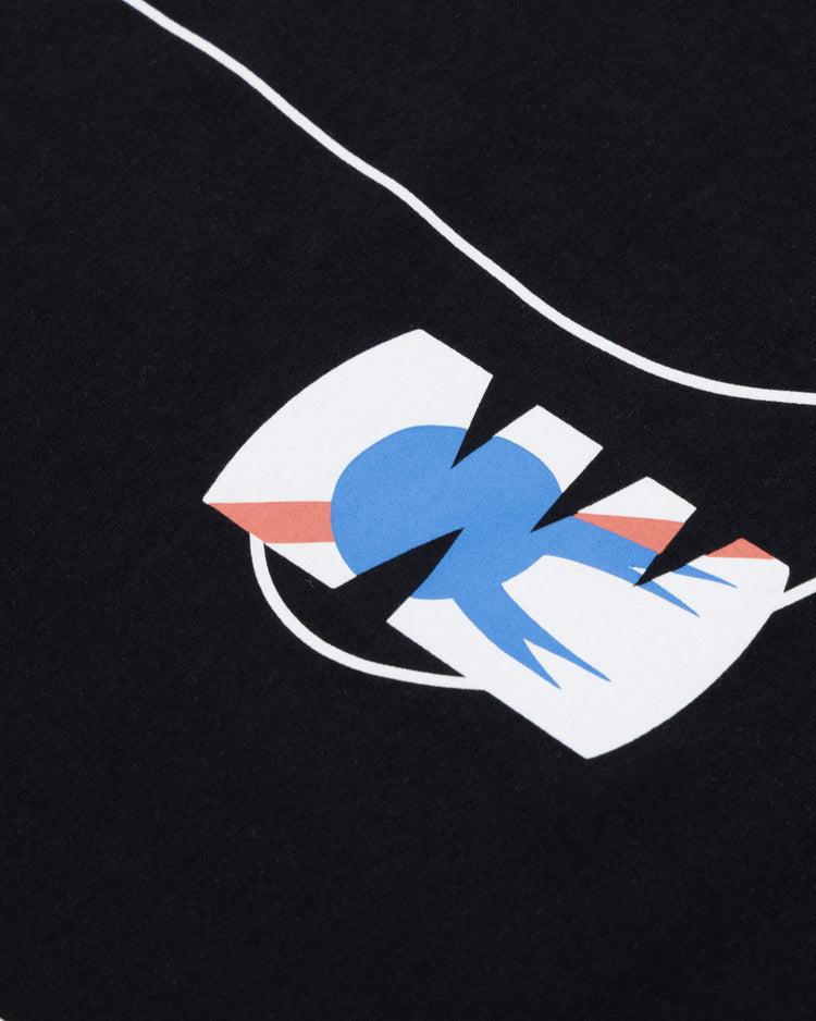 A close-up of the PBR EFF Vintage Beer T-Shirt - Ghost by Ebbets Field Flannels: a graphic design on black fabric with a fragmented white rectangle, blue bird, and red accents—evoking classic Pabst Blue Ribbon style. Thin white lines complete the look.