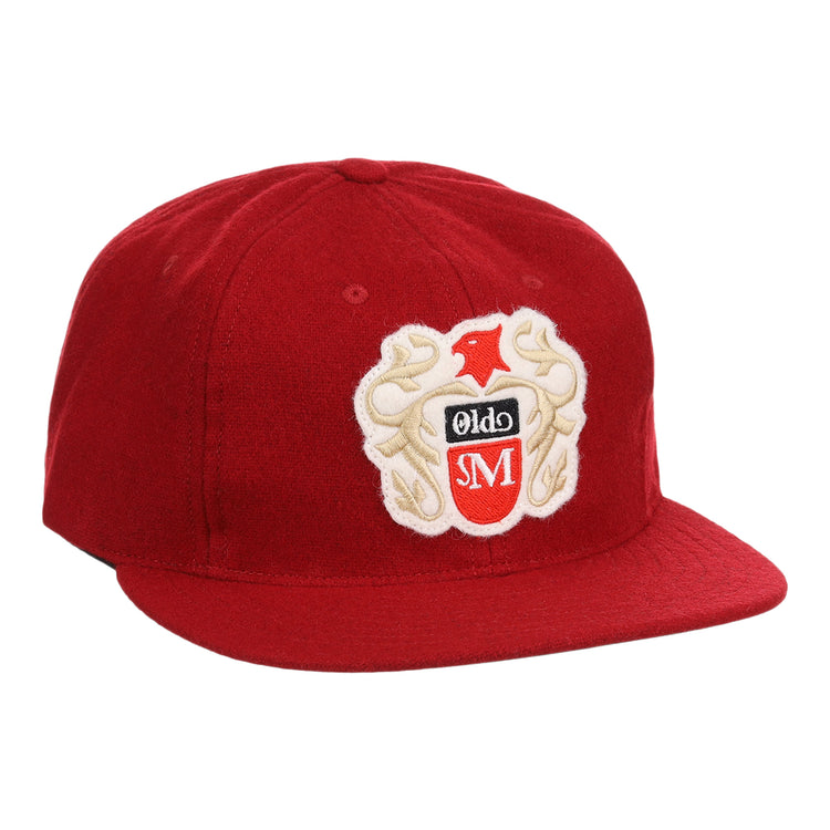 The Old Milwaukee EFF Vintage Beer Wool Ballcap by EFF is a red cap with an embroidered bird, Olde, and SM crest on the front. It features a flat brim and structured crown, ideal for classic American Lager fans.