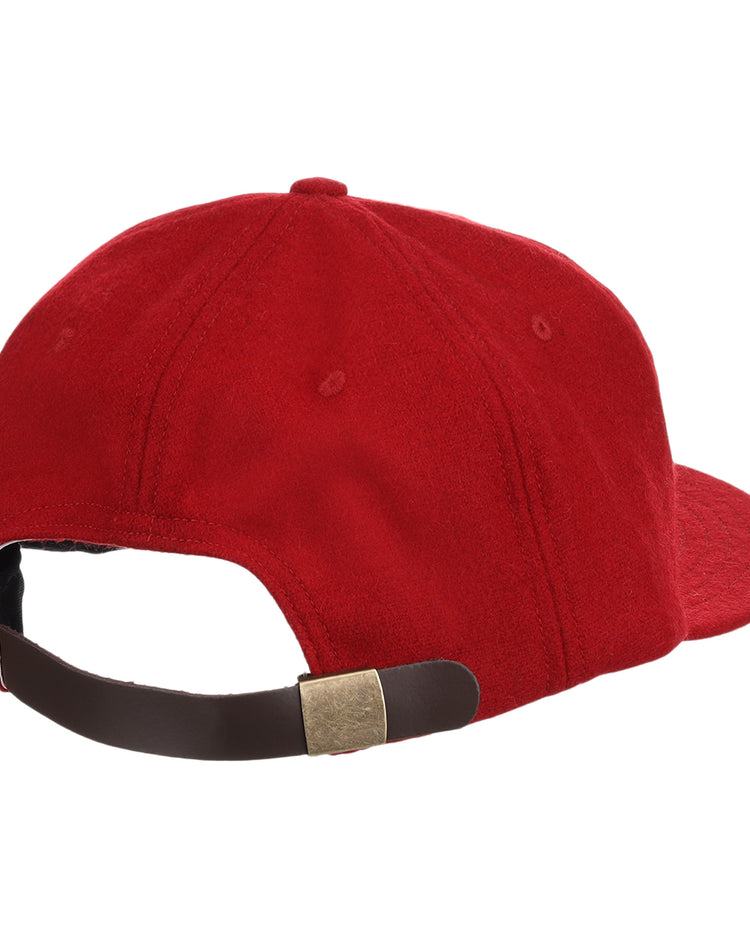 The Old Milwaukee EFF Vintage Beer Wool Ballcap by EFF is a red vintage cap shown from the back, featuring a brown adjustable strap with a gold buckle.