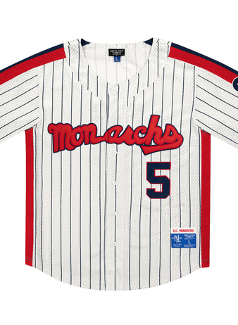 The EFF Kansas City Monarchs NLB Pinstripe Button Down Jersey features white pinstripes, red Monarchs text, number 5, blue and red accents, a KC sleeve patch—classic Negro National League style from Ebbets Field Flannels.