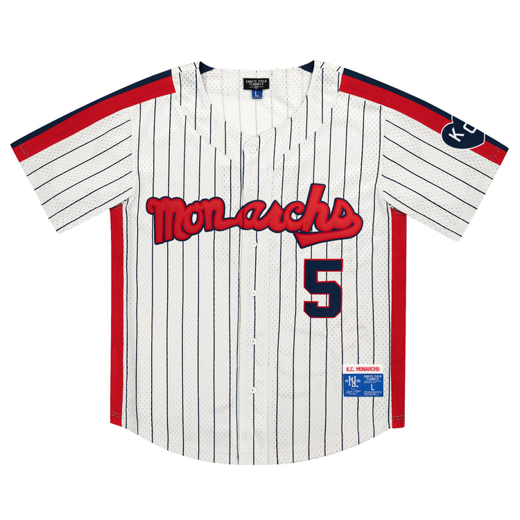 The EFF Kansas City Monarchs NLB Pinstripe Button Down Jersey features white pinstripes, red Monarchs text, number 5, blue and red accents, a KC sleeve patch—classic Negro National League style from Ebbets Field Flannels.