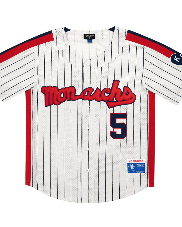 The EFF Kansas City Monarchs NLB Pinstripe Button Down Jersey features white pinstripes, red Monarchs text, number 5, blue and red accents, a KC sleeve patch—classic Negro National League style from Ebbets Field Flannels.